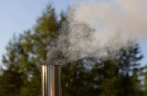 The smoke from the chimney Stock Photos