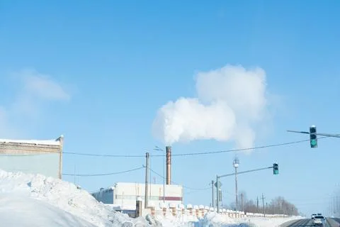 Smoke from the chimney from processing hazardous materials at the factory. Re Stock Photos