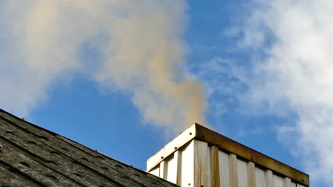 Smoke from the chimney up into the sky Stock Footage 136574164