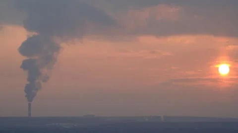 Smoke from chimney at sunset Video stock 10680849