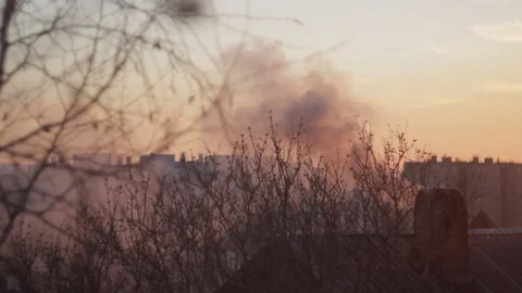 Smoke from the chimney at sunset Stock Footage 89741109