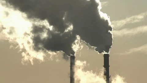Smoke from the chimneys. Close-up. The sun through the smoke. Pipes in Stock Footage 150104337
