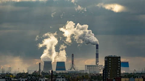 Smoke from chimneys forms clouds. A lot of pipes in industrial, residential area Stock Footage 143587609