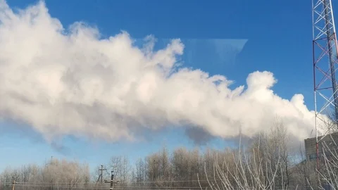 The smoke from the chimneys goes high into the sky Stock Footage 121050331