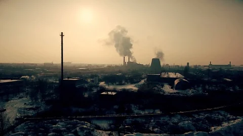 The smoke from the chimneys on the horizon Stock Footage 85831292
