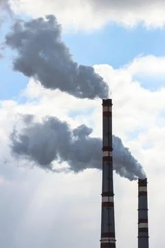 Smoke from chimneys Stock Photos