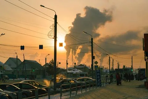 Smoke from CHP at sunset backdrop of small suburb of Chelyabinsk Stock-Fotos
