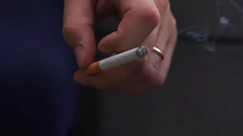Smoke cigarette Fire In Hands Stock Footage 247449900