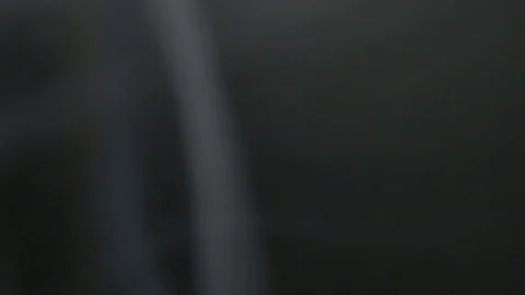 Smoke from cigarettes on a black background Video stock 78989946