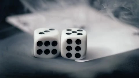 Smoke clears to reveal dice Stock Footage 306057348