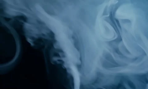 Smoke. Cloud of cold fog in blue light spot on black background Stock Footage 302287670
