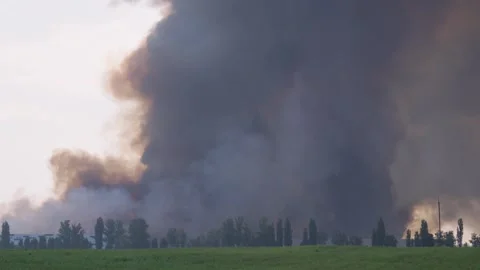 Smoke Clouds Rise into the Sky from a Massive Blaze 스톡 동영상 343854242
