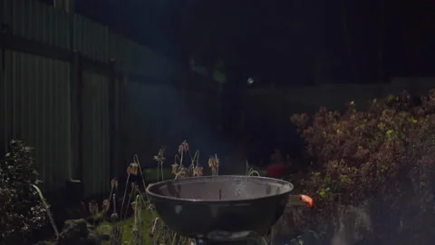 Smoke comes from the barbecue maker Видео 166931030