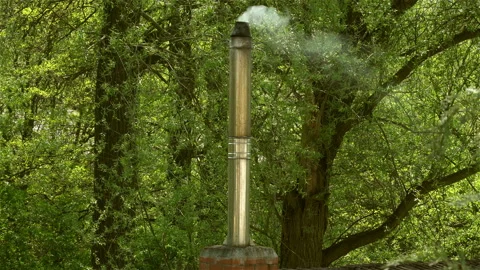 Smoke comes from the chimney.  Stock Footage 106111947