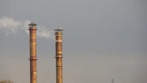 Smoke comes from the chimneys. Stock Footage 76868306