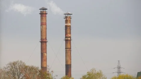 Smoke comes from the chimneys. Stock Footage 76868358