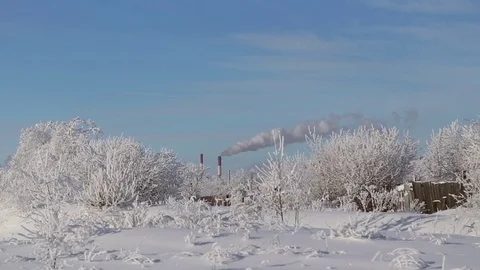 The smoke comes from the chimneys in winter Stock Footage 71584797
