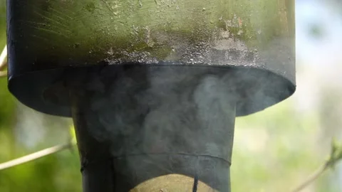 Smoke comes from an old rusty metal round pipe. Stock Footage 196167378