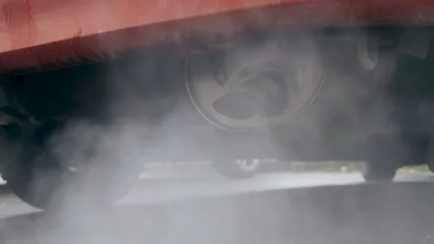 Smoke is coming from the exhaust pipe of an old car. Stock Footage 217324073