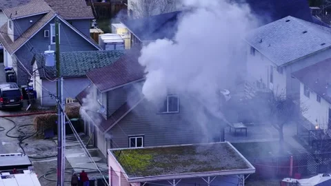 Smoke coming from inside a house fire Stock Footage 328938664