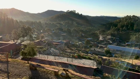Smoke coming towards the camera overlooking a rural mountain view Stock Footage 107265288