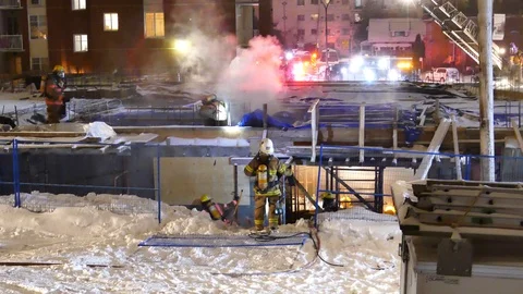 Smoke at construction site during winter at night Stock Footage 104026468