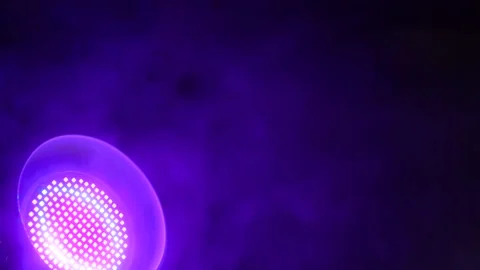 Smoke in a dark room with a sub-light. Defocus Stock Footage 144184281