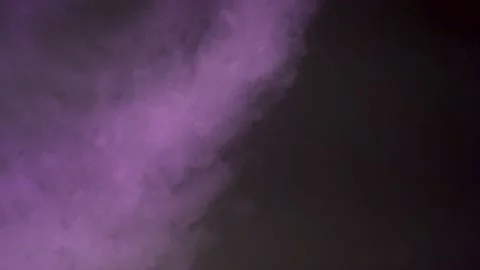 Smoke in a dark room with a sub-light. Defocus Stock Footage 144184292