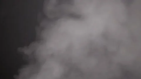 Smoke in a dark room with a sub-light. Defocus Stock Footage 144184315
