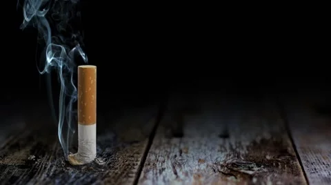 Smoke of Death Table Butt Stock Footage 44726491