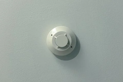 Smoke detector mounted on plain ceiling, fire alarm system Stock Photos