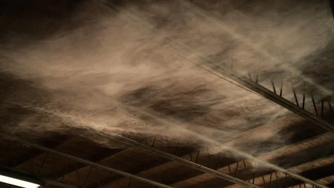 Smoke drifting beneath industrial ceiling with fluorescent light, atmospher.. Stock Footage 335646965