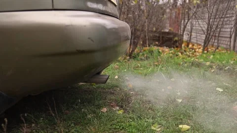 Smoke From The Exhaust Pipe Of The Car. The Machine Warms The Engine. Stock Footage 143325035
