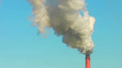 Smoke exits the pipe of a coal-fired power station. Video stock 83927097