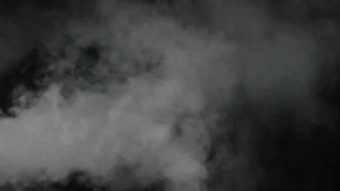 Smoke explosion burst in dark studio environment with dynamic motion Stock Footage 346438944