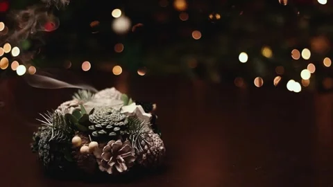 Smoke from an extinguished candle against the background of Christmas lights Stock Footage 270972275
