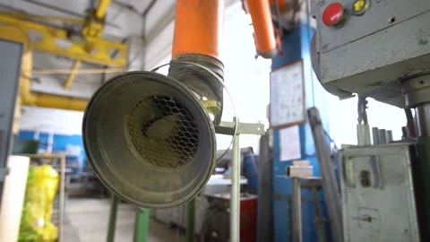 The smoke extraction system operates in a factory environment to ensure worker Stock Footage 330638219