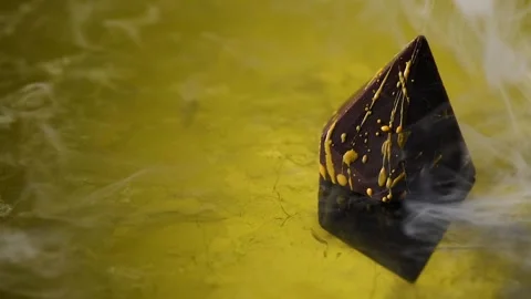 Smoke falling on a chocolate sweet. Stock Footage 132044007
