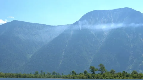 Smoke from a fire in a mountain forest. Video stock 93555192