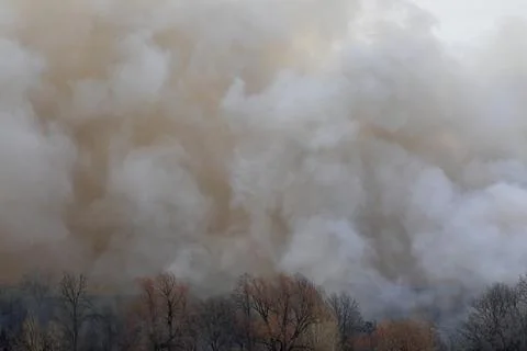 Smoke from a fire in a textile factory Stock Photos