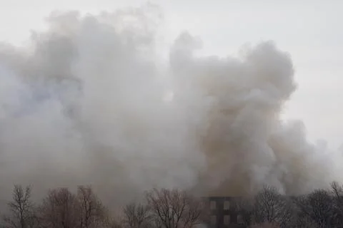 Smoke from a fire in a textile factory Stock Photos