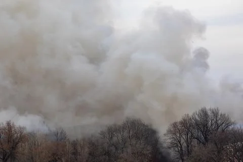 Smoke from a fire in a textile factory Stock Photos