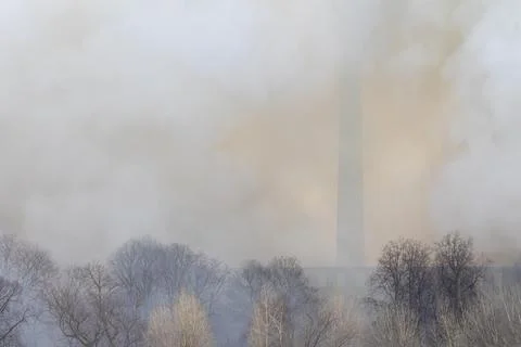 Smoke from a fire at a textile factory Stock Photos