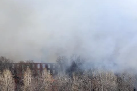 Smoke from a fire at a textile factory Stock Photos