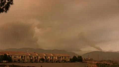 Smoke from fires burning in the distance Stock Footage 102694620