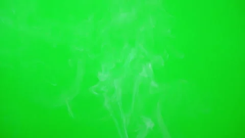 Smoke floating on green screen background of slow motion video  Vídeo Stock 228816913