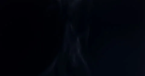Smoke floating through space against black background Stock Footage 139099907