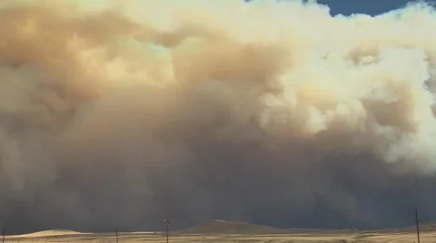 Smoke from forest fire over mountain top Stock Footage 40750527