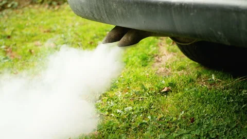 Smoke goes from tail pipe of old diesel car Stock Footage 163574259