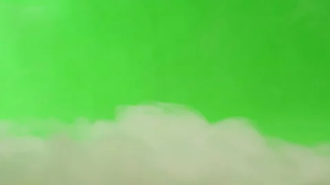 Smoke on green chroma key background. Smoking, steam clouds of vapour close-up Video stock 219886386